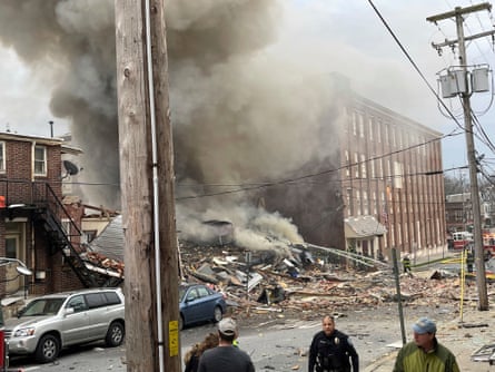 Paramedics work at the site of the March 24 explosion.