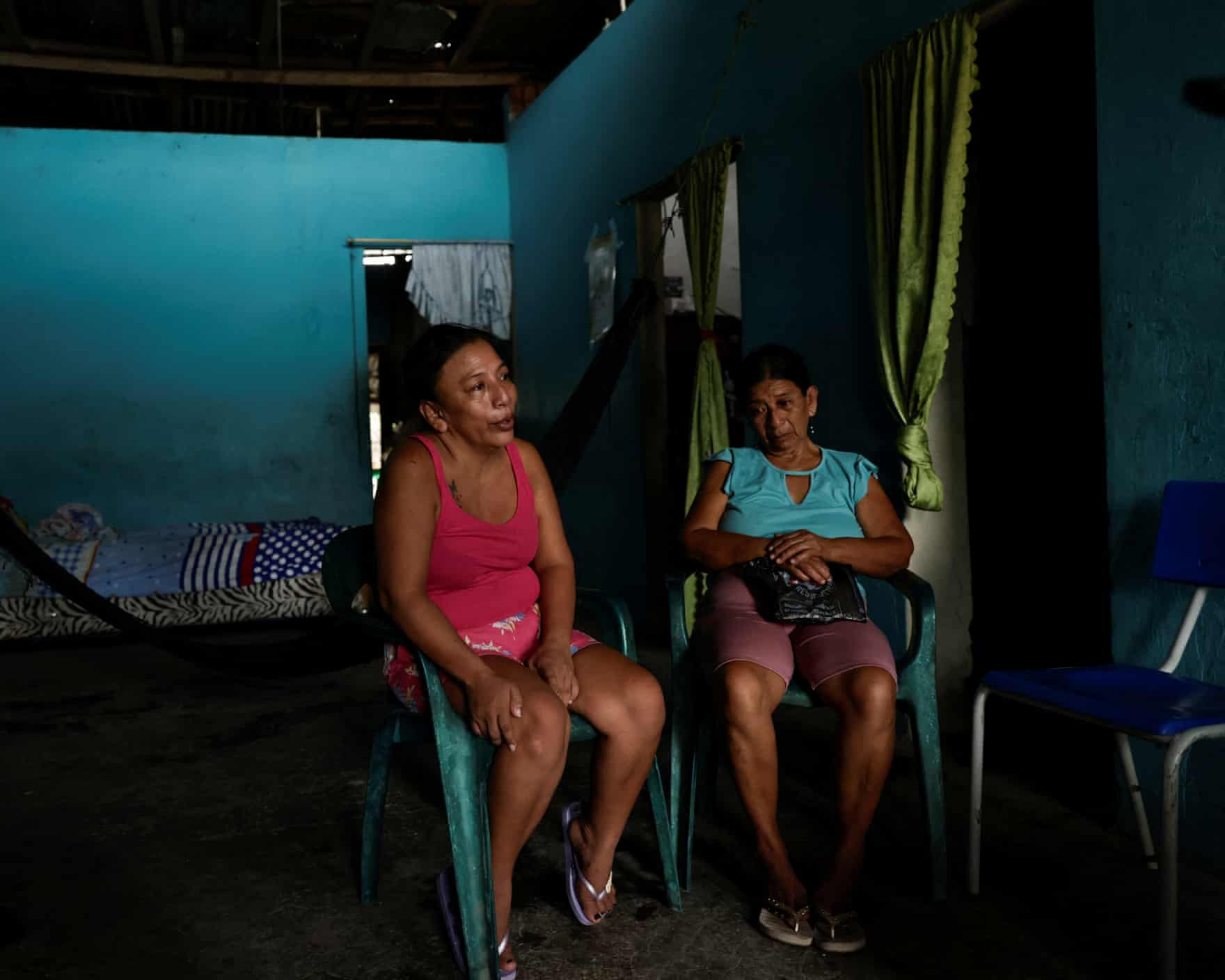Two women sitting in chairs
