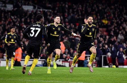 Matheus Cunha (right) wheels away alongside Diogo Dalot (centre) and Kobbie Mainoo after scoring a spectacular winner for United