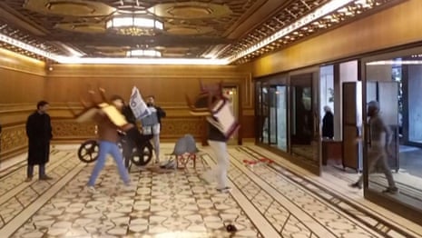 Syrian rebels carry furniture from presidential palace after 'capturing' Damascus – video