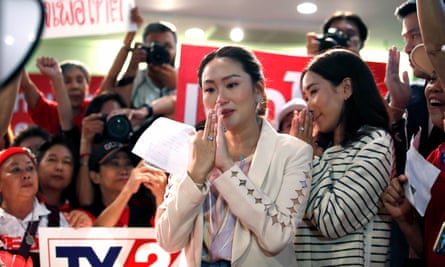 Pheu Thai Party’s Prime Ministerial candidate Paetongtarn Shinawatra (L) and her older sister Pintongtha (R) thank supporters attending the former’s birthday party at the party headquarters in Bangkok, Thailand, 21 August 2023.