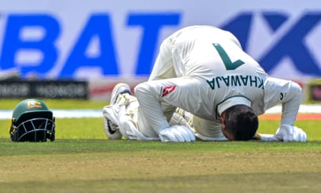 Australia’s Usman Khawaja kisses the Galle turf after scoring a double century in the first Test.