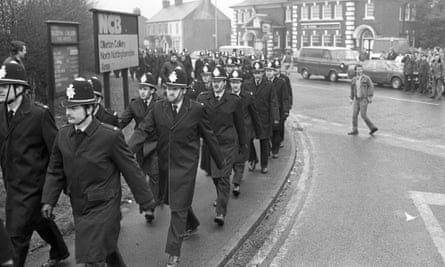 Police march in Ollerton, Notts