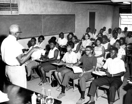 Man in front of students at desks