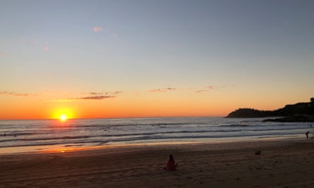 Sunrise at Manly beach in July. In the distance you can see the headland off Shelly Beach which protects the waters for the ocean swimmers between Manly and Shelly.