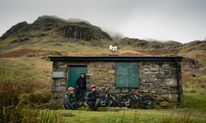 Mountain bikers on a litter pick on Helvellyn, UK