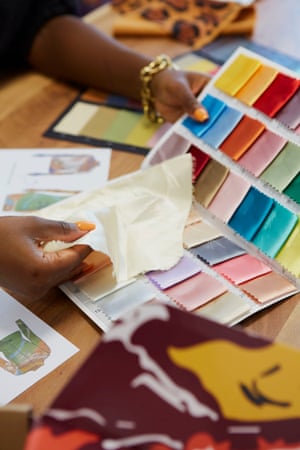 ‘I need black girls to be seen’: meet the designer whose garments rejoice confidence | Empowering enterprise 2 Detail of Fisayo Longe holding fabric swatches