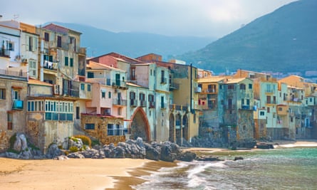 Houses line the beach in Cefalù.