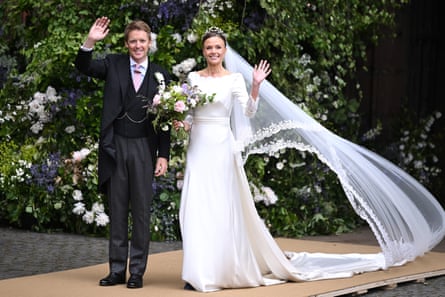 Hugh Grosvenor, Duke of Westminster, and Olivia Grosvenor, Duchess of Westminster, in wedding clothes waving