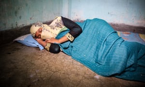 Fatima in the room where she sleeps with two other garment workers.