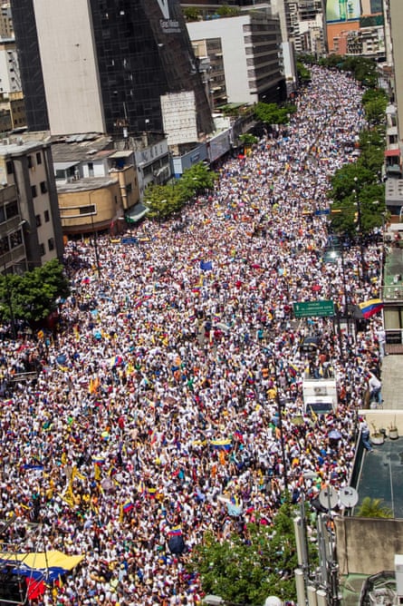 Thousands of people participate in a referendum rally in Caracas last September.
