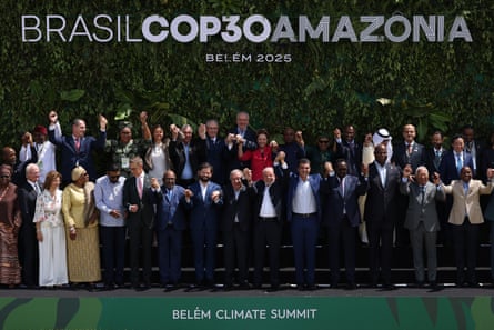 Lula and world leaders hold hands and pose for a photo during the Belém climate summit.