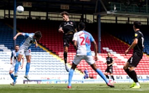 Jamie Paterson of Bristol City (second left) heads in the opening goal.