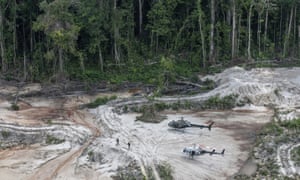 Inspectors walk through an area affected by illegal mining in Pará state in Brazil’s Amazon basin