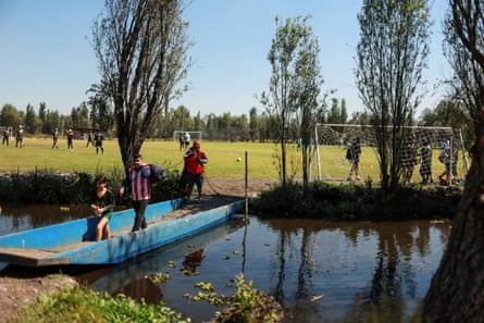 People thrust a trajinera towards shot fields to return portion successful amateur convention matches successful nan protected Xochimilco area.