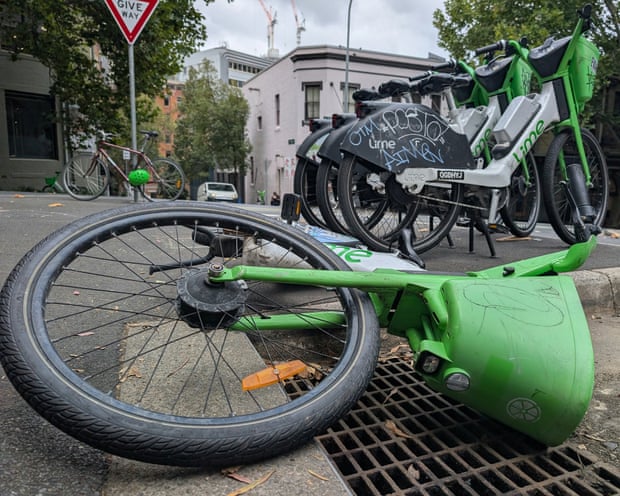 A shot of a Lime bike lying flat on the street