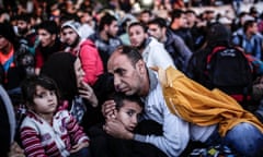 Refugees wait in Istanbul for buses to the Turkish-Greek border