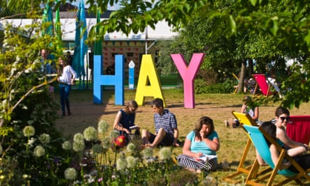 People relaxing at Hay Festival in 2018, in Hay-on-Wye, Wales.
