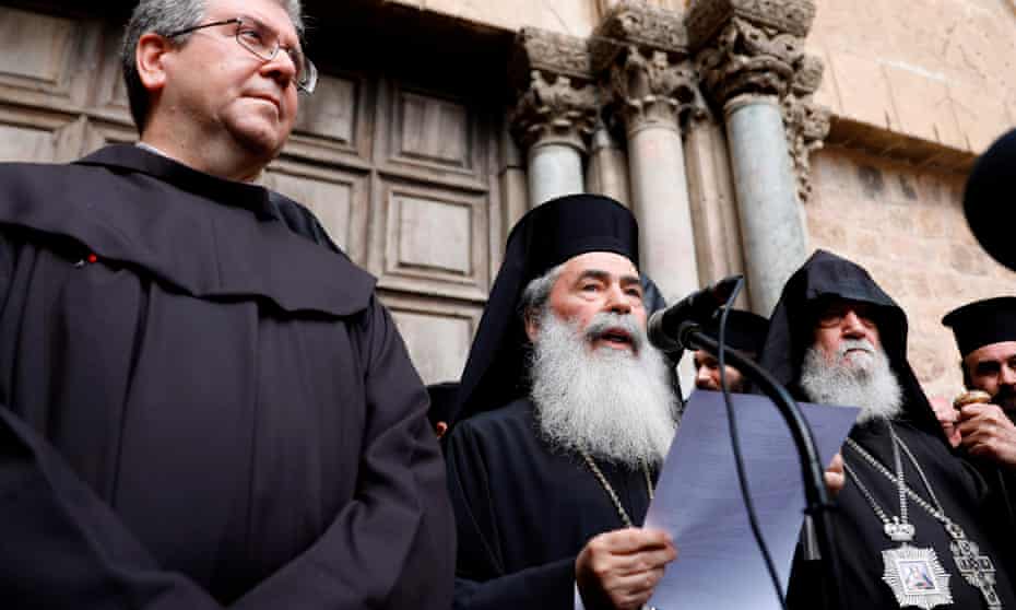 Greek Orthodox leader Theophilos III delivers a statement to the press outside the closed doors of the Church of the Holy Sepulchre in Jerusalem’s Old City