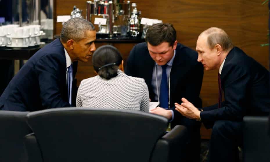 Barack Obama talks to Vladimir Putin during a break of the G20 summit working session in Antalya, Turkey, on Sunday.