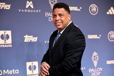 Ronaldo Nazario smiles in a dark suit at the Ballon d'Or red carpet
