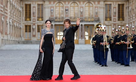 Mick Jagger and his partner US choreographer Melanie Hamrick arrive at the banquet