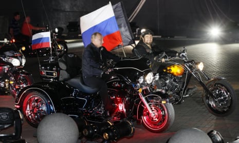 Vladimir Putin rides a three-wheeler, accompanied by the Night Wolves biker group leader, Alexander Zaldostanov, in Russia.