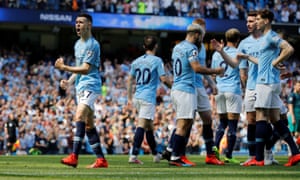 Manchester City’s Phil Foden celebrates scoring their first goal.