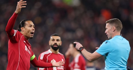 Virgil van Dijk (left) reacts towards referee Alejandro Hernandez after he gives a penalty against the Liverpool player for handball.