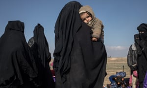 Families flee the village of Baghuz before an offensive on the last Isis-held area in Syria.