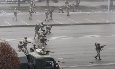 Security forces advance in Almaty in Kazakhstan on Thursday morning. Protests sparked by rising fuel prices have seen the government resign and ‘peacekeeping forces’ sent in.