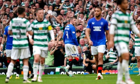 Rangers' John Lundstram (back centre) leaves the field after being shown a red card for a foul on Celtic's Alistair Johnston.