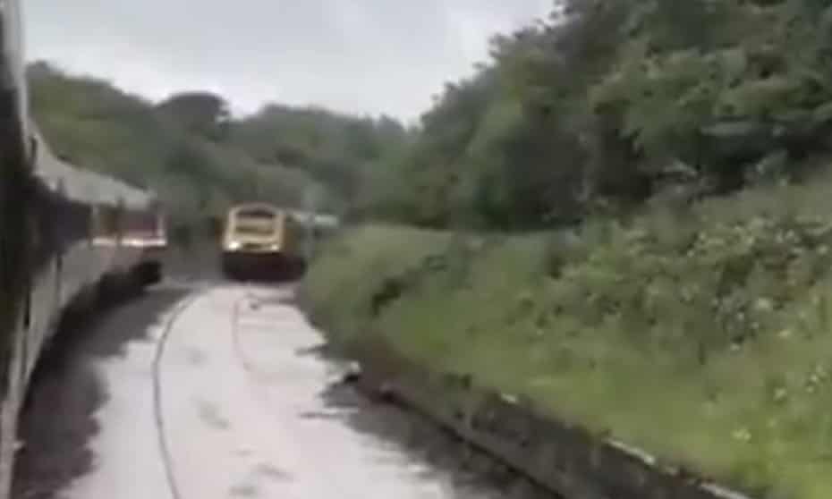 A flooded railway line near Corby after a landslide left two trains stranded.
