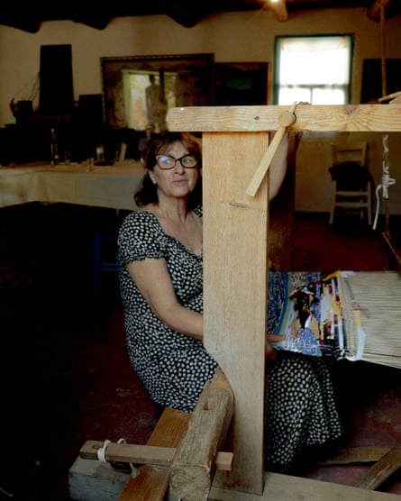 Marilena sits at a loom