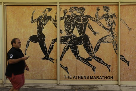 A man passes a store front of souvenir shop in the Plaka tourist district of Athens, Tuesday, July 28, 2015. Emissaries from Greece’s international creditors are holding preparatory talks with Greek officials as the aim is to thrash out the terms of the deal before Aug. 20, when Greece must make a debt payment that it cannot afford without new loans. (AP Photo/Thanassis Stavrakis)