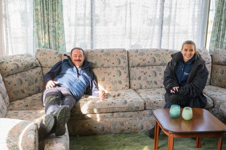 Danny and Dani relaxing in a caravan interior.