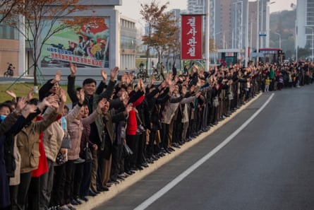 People line the streets in Pyongyang to welcome home players after their Under-17 World Cup victory in 2024.