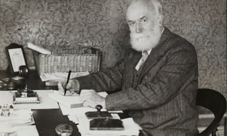 CP Scott at desk facing camera