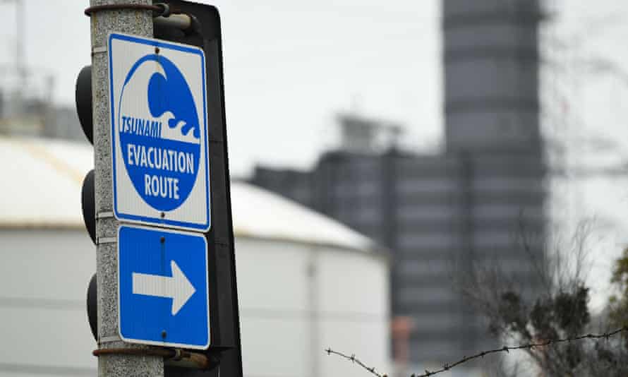 A tsunami evacuation route sign is displayed in El Segundo, California, on Saturday.