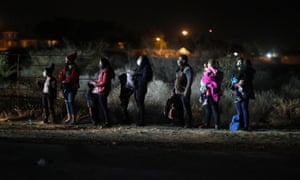 Queue of migrants in dark