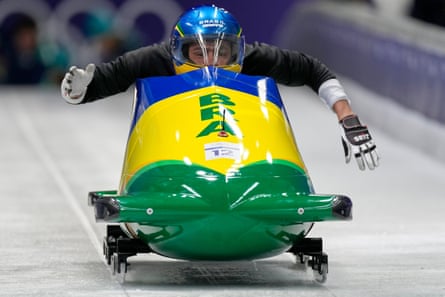 Brazil’s Edson Luques Bindilatti pilots in the bobsleigh men’s two-man training session