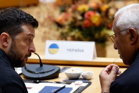 European Council president António Costa, speaks with Ukraine's President Volodymyr Zelenskyy during a round table meeting at the EU summit in Brussels.