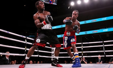 Day (left) and Charles Conwell slug it out in the fourth round of their super-welterweight bout at Wintrust Arena in Chicago. The fight ended in the 10th.