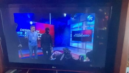 Hooded and armed people take over a TV studio of the Ecuador TC network during a live broadcast