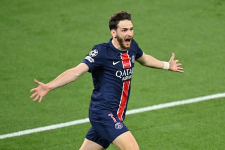 Khvicha Kvaratskhelia of Paris Saint-Germain celebrates after winning the Champions League.