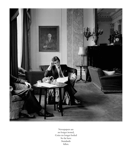 Photograph of a man sitting in a chair in a gentlemen's club, resting his head on his hand and holding a newspaper.