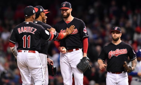 Corey Kluber (middle) is congratulated by team-mates as he makes his way off the mound in the seventh inning