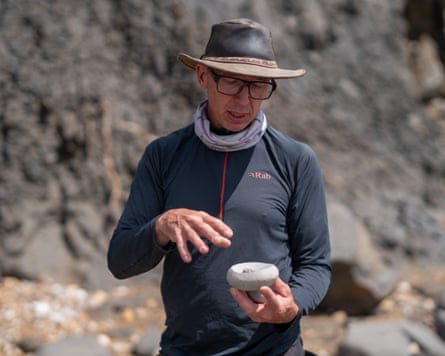 Martin Curtis searching the coastline for fossils.