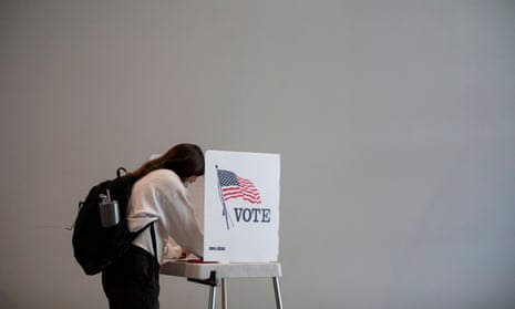 People cast their ballots as early voting begins in Ann Arbor, Michigan, on 24 September 2020. 