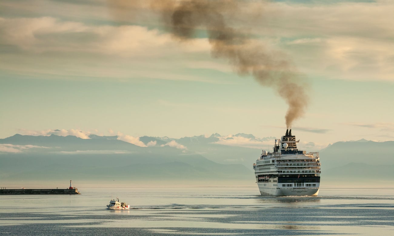 Cruise ship with smoke pouring from funnel